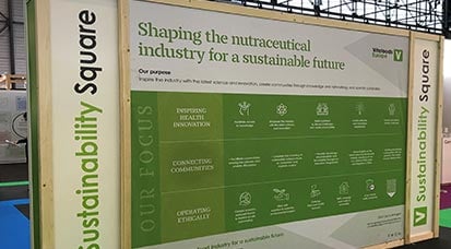 Photo of a notice board showing information on sustainability actions within  the neutraceutical industry